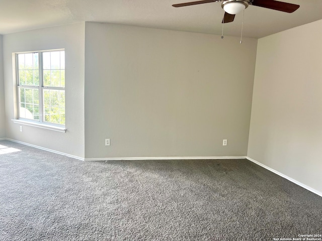 spare room featuring ceiling fan and carpet floors