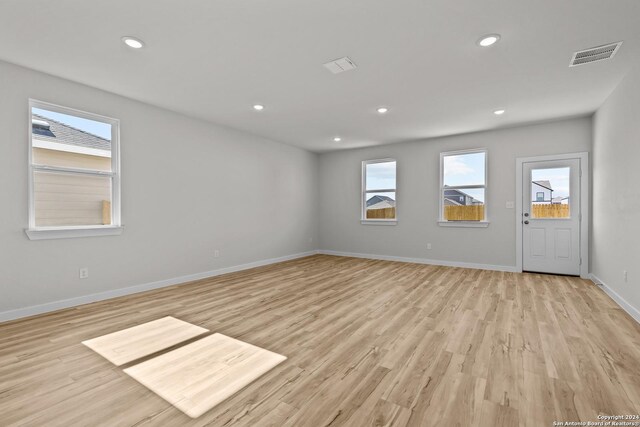 spare room with light hardwood / wood-style flooring