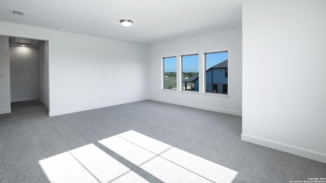 empty room with carpet flooring