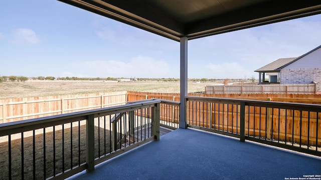 balcony featuring a rural view