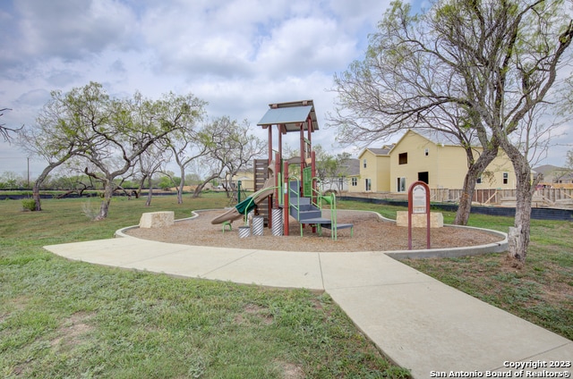 view of play area with a yard