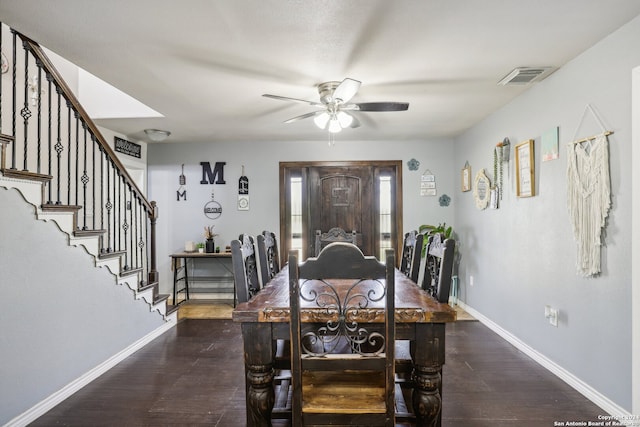 dining space with ceiling fan and dark hardwood / wood-style floors