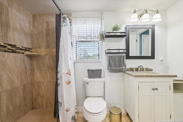 bathroom with vanity, tile patterned flooring, curtained shower, and toilet