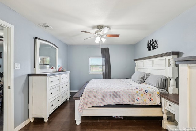 bedroom with ceiling fan and dark wood-type flooring