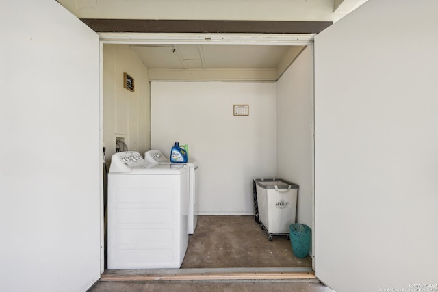 clothes washing area featuring separate washer and dryer