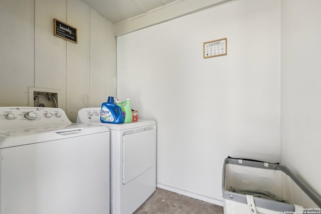 laundry area with independent washer and dryer