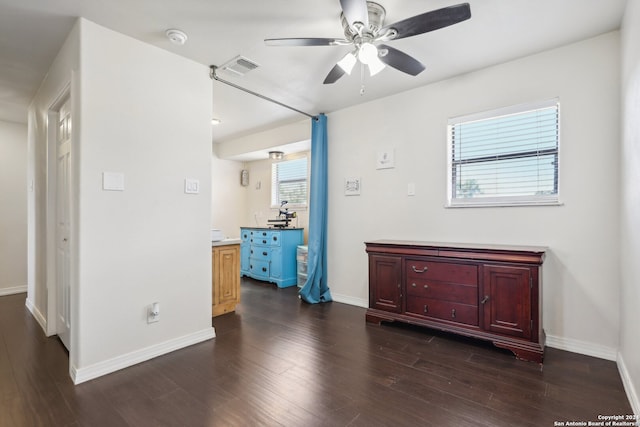 bedroom with ceiling fan and dark hardwood / wood-style flooring