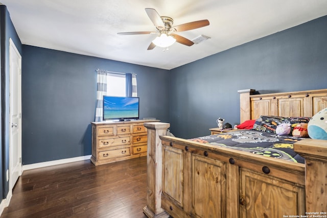 bedroom featuring ceiling fan and dark wood-type flooring