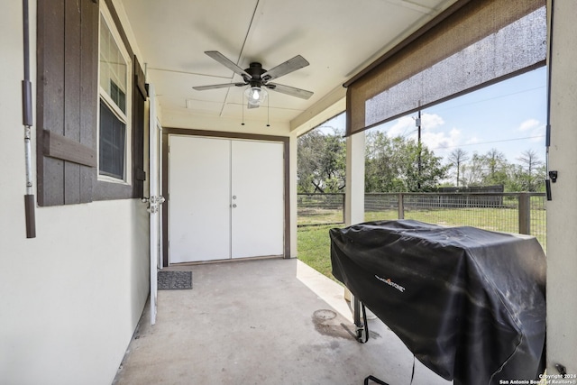 sunroom featuring ceiling fan