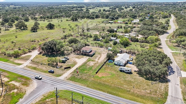 birds eye view of property featuring a rural view