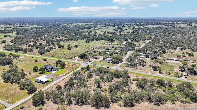 birds eye view of property featuring a rural view