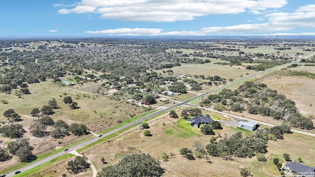 birds eye view of property featuring a rural view