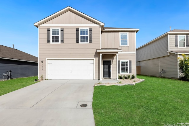 view of front facade featuring a garage and a front lawn