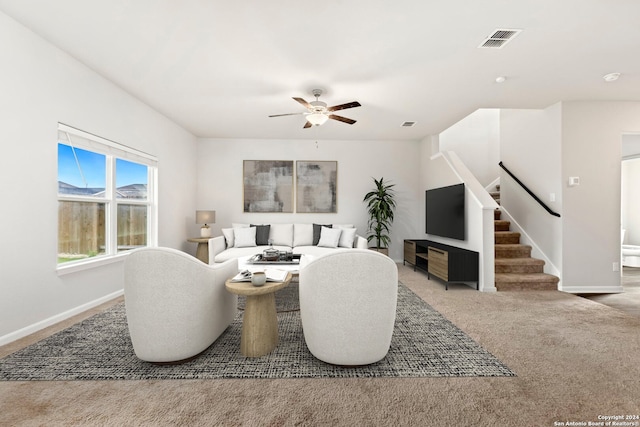 living room featuring carpet and ceiling fan