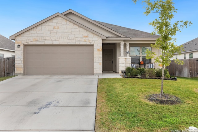 ranch-style home featuring a front yard and a garage