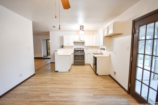 kitchen featuring light hardwood / wood-style flooring, gas stove, white cabinetry, and sink