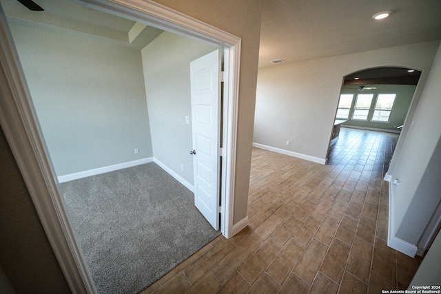 hallway featuring dark hardwood / wood-style flooring