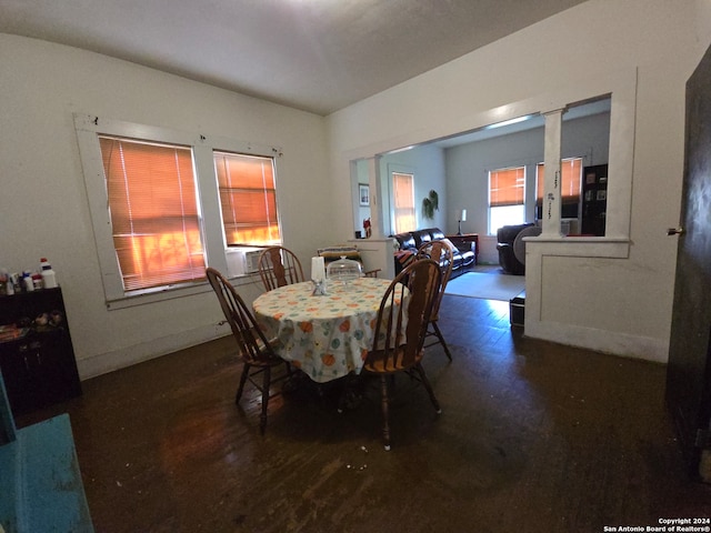 dining space with dark wood-type flooring