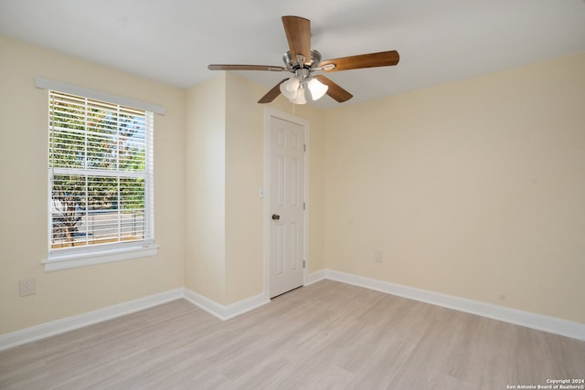 spare room with ceiling fan and light hardwood / wood-style floors