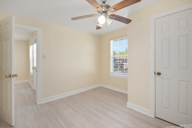 spare room with ceiling fan and light hardwood / wood-style flooring