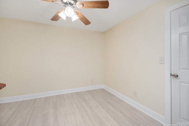 empty room with light wood-type flooring and ceiling fan