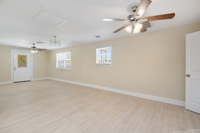 unfurnished room with ceiling fan and light wood-type flooring