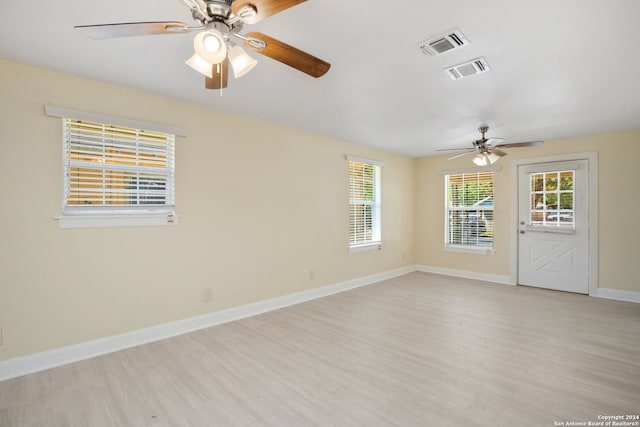 unfurnished room featuring ceiling fan and light wood-type flooring