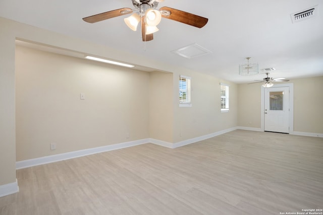 spare room with ceiling fan and light hardwood / wood-style flooring