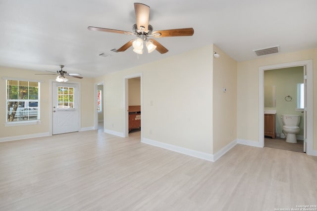 empty room featuring ceiling fan and light hardwood / wood-style flooring