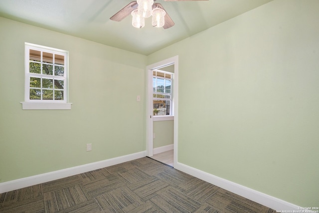 spare room with ceiling fan