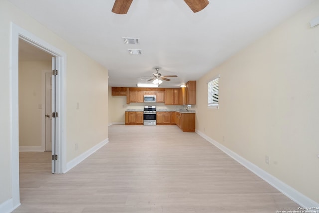 interior space with light hardwood / wood-style floors and ceiling fan