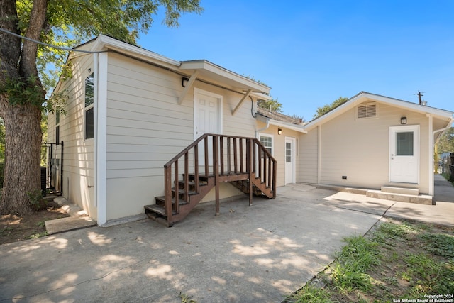 rear view of property featuring a patio