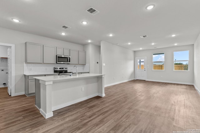 kitchen with visible vents, appliances with stainless steel finishes, and gray cabinets
