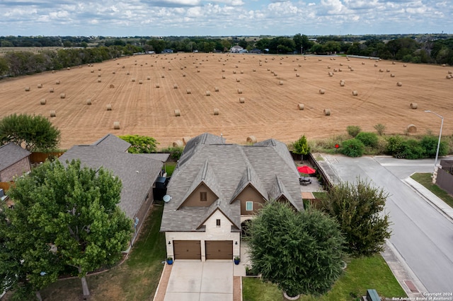 birds eye view of property featuring a rural view