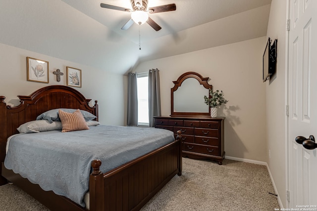 carpeted bedroom with lofted ceiling and ceiling fan