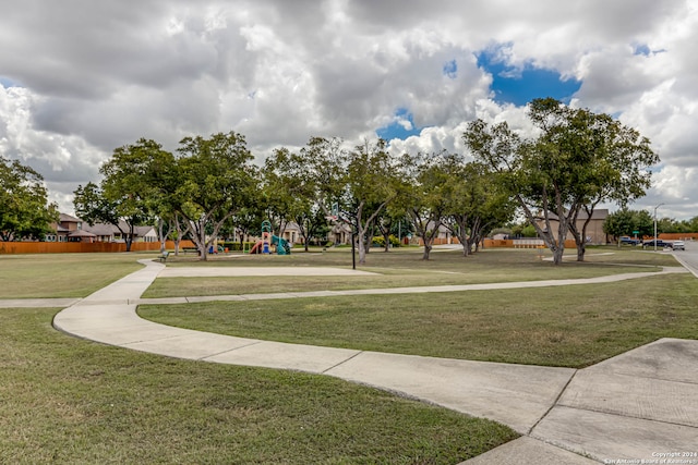 view of home's community with a lawn