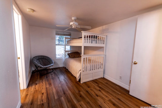 unfurnished bedroom with dark wood-type flooring and ceiling fan