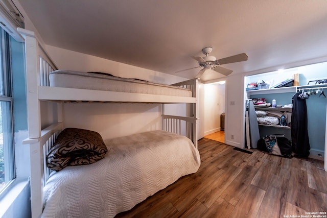 bedroom with ceiling fan and hardwood / wood-style floors