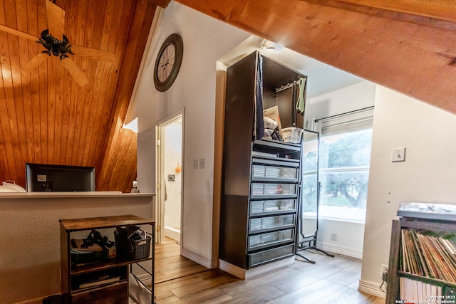 interior space with ceiling fan, light hardwood / wood-style floors, vaulted ceiling, and wood ceiling