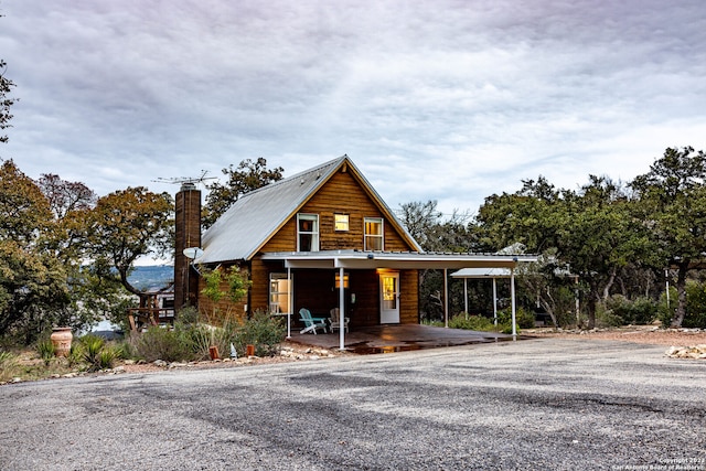 log cabin with a carport