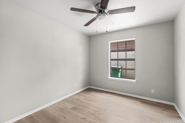 spare room featuring ceiling fan and light wood-type flooring