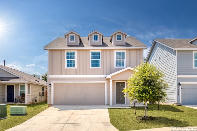 view of front of home featuring a front lawn and a garage