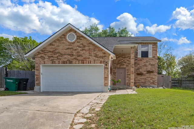 view of front facade featuring a front lawn and a garage