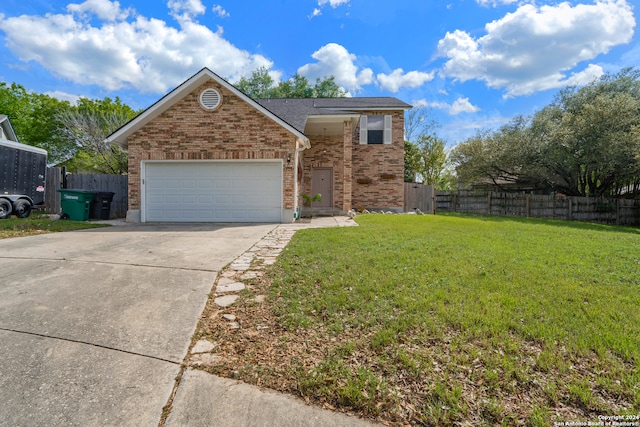 view of front of house featuring a front yard and a garage