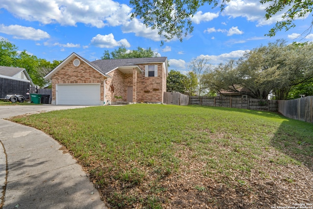 view of front of house with a garage and a front lawn