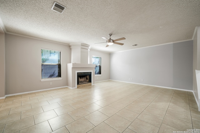 unfurnished living room with ceiling fan, crown molding, and a textured ceiling