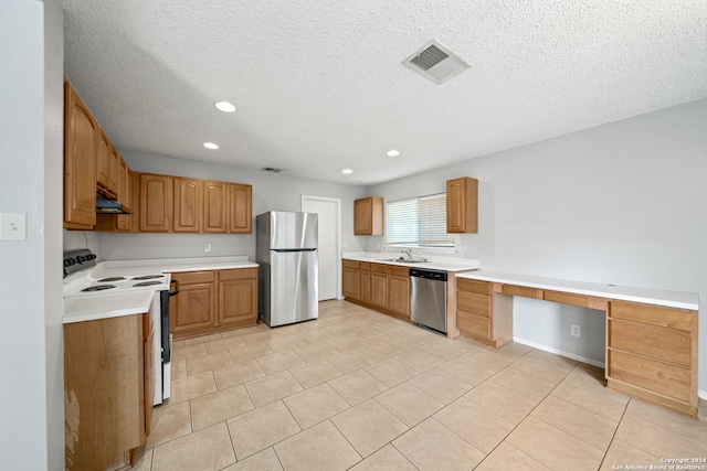 kitchen with light tile patterned floors, sink, a textured ceiling, appliances with stainless steel finishes, and range hood