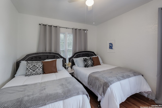 bedroom featuring wood-type flooring and ceiling fan