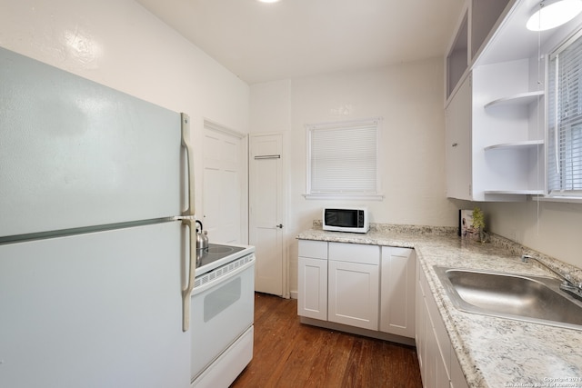 kitchen with white cabinets, white appliances, dark wood-type flooring, and sink