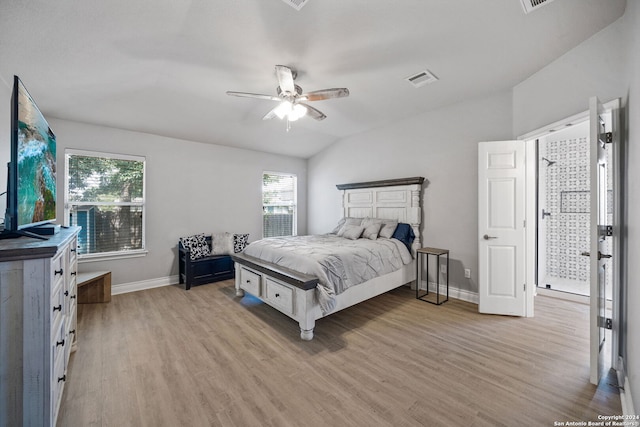 bedroom featuring light wood-type flooring, multiple windows, and ceiling fan